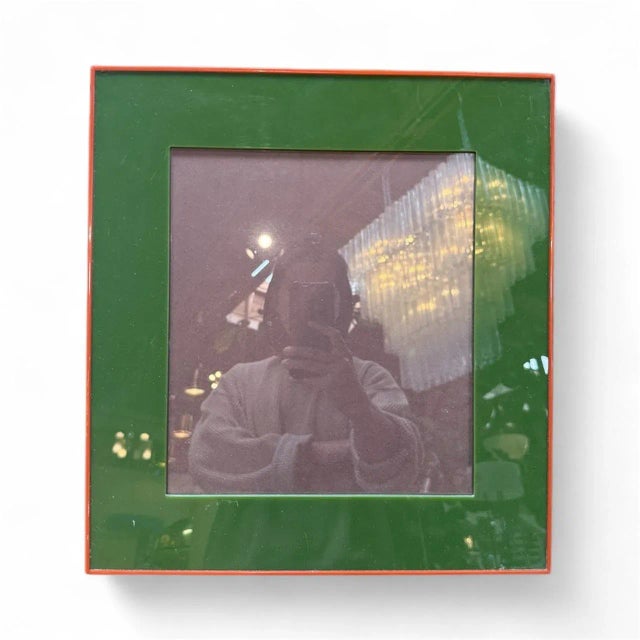 This square green and red enamel photo frame offers a bold and modern aesthetic with a refined luxury touch. The frame...