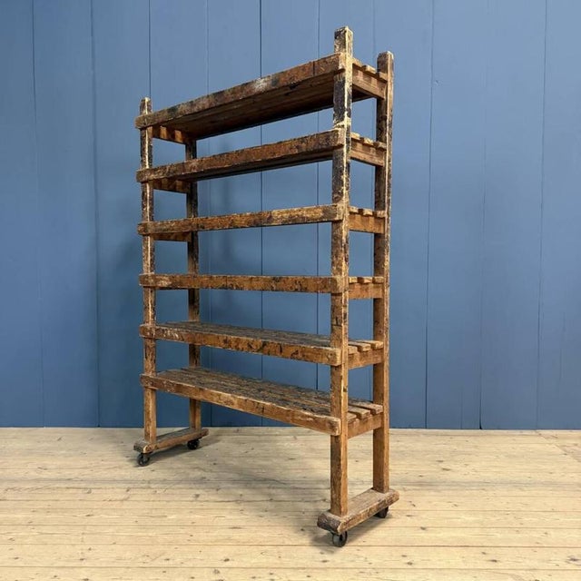 Old wooden rack originating from a shoemaker's workshop in Nijmegen, circa 1920. The wooden rack is mobile thanks to the...