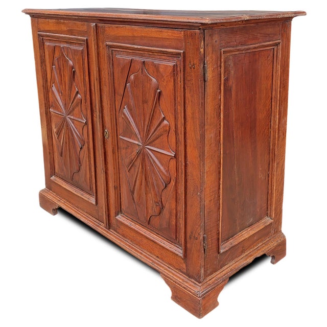 Piedmontese walnut sideboard Antique Piedmontese walnut cabinet, an expression of late‑17th‑century woodworking, featuring...