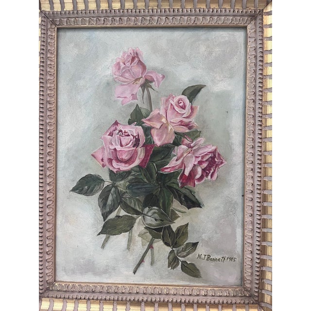 A charming signed oil on canvas depicting a bouquet of delicate pink roses against a softly rendered neutral background....