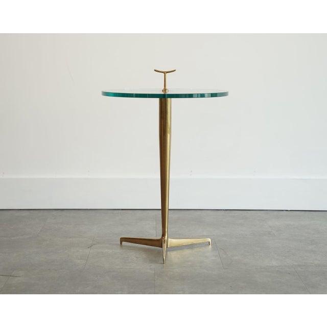 Elegant and refined, this Italian brass side table captures the spirit of mid-century design, reminiscent of the work of...