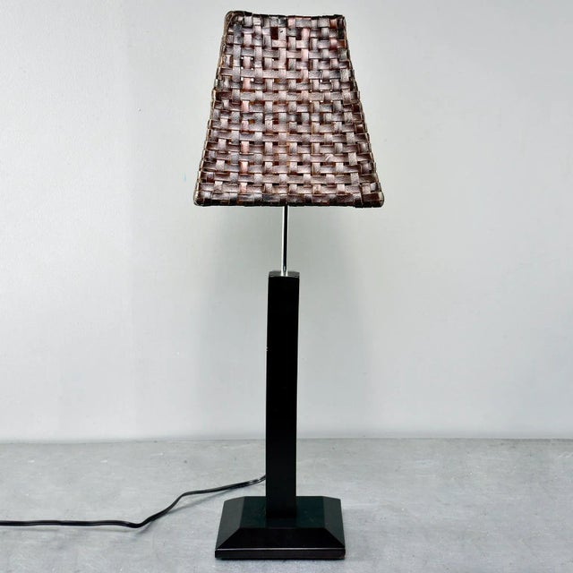 Italian table lamp has a sleek dark wood base with polished nickel adjustable support. Height can be adjusted from...