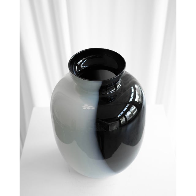 This large glass vase, likely made from Murano glass, was sourced in Italy. It’s a striking piece and is in excellent...