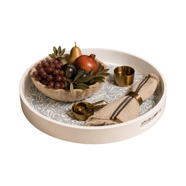 Executed in the historic maque lacquer tradition of Olinalá, Guerrero, Mexico, this circular tray reflects a lineage of...
