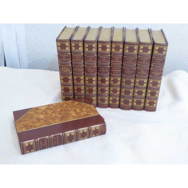 This collection of works by Thackery are a rich sienna brown with gold lettering.