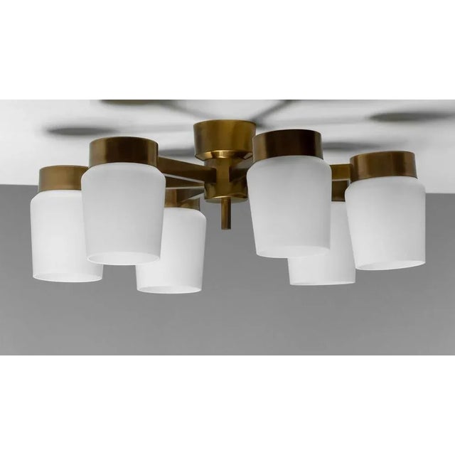 Beautiful and large flush mount in brass with six large frosted glass / opaline glass vases made in the 1960s by Fagerhult...