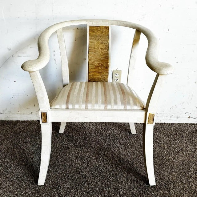This elegant Ming-style armchair showcases exquisite tessellated stone craftsmanship paired with gleaming brass inlays....