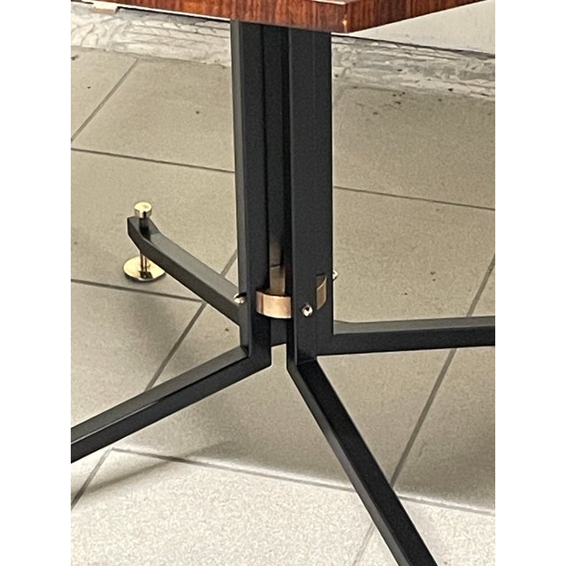 Dining table by Ico Parisi for Brugnoli Mobili Cantù, produced in 1955. The table has a square-section tubular iron frame...