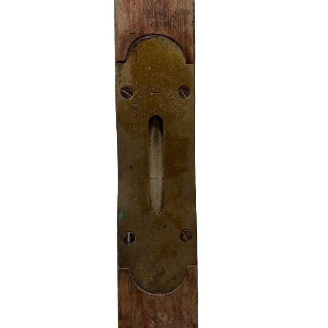 This primitive carpenter's tool is marked "Sargent & Co. NY." It has a long center "bubble" and a circular "bubble" used...