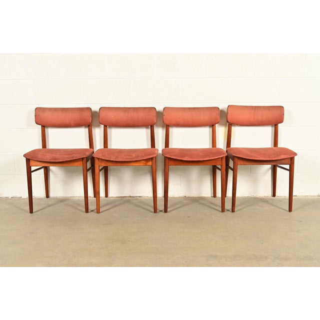 A sleek and stylish set of four mid-century Danish Modern dining chairs In the manner of Finn Juhl By Sven Chrobat for Sax...