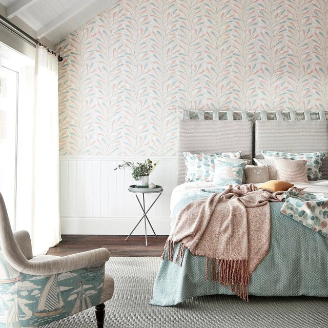 A set of 4 double rolls of Sanderson “Port Sea” wallpaper in a soft pastel palette of blush, aqua, and muted tones....
