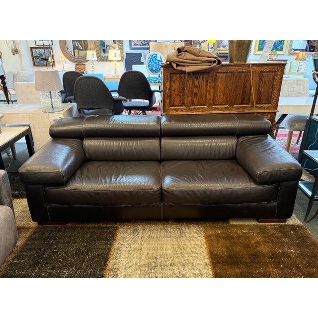 Design Plus Gallery presents a Black Leather Sofa from Calia Italia. The contemporary sofa exudes a sense of relaxation,...