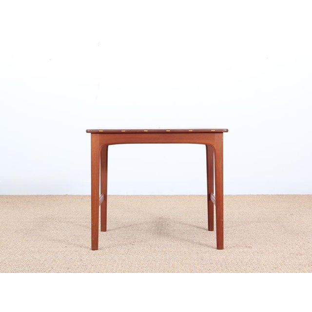 This Scandinavian side table in solid teak by Yngvar Sandström was produced by the Swedish carpenter AB Seffle...