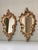 Great pair of 19th century Italian Rococo style cream painted and parcel giltwood mirrors. Crafted of both wood and...