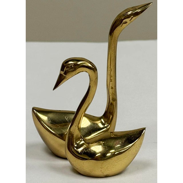 Petite pair of shiny brass swans. Elegant forms with very clean lines. No patina, high quality.