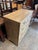 A "two-over-three" arrangement (two small drawers over three full-width drawers). Material: It features a bleached or...