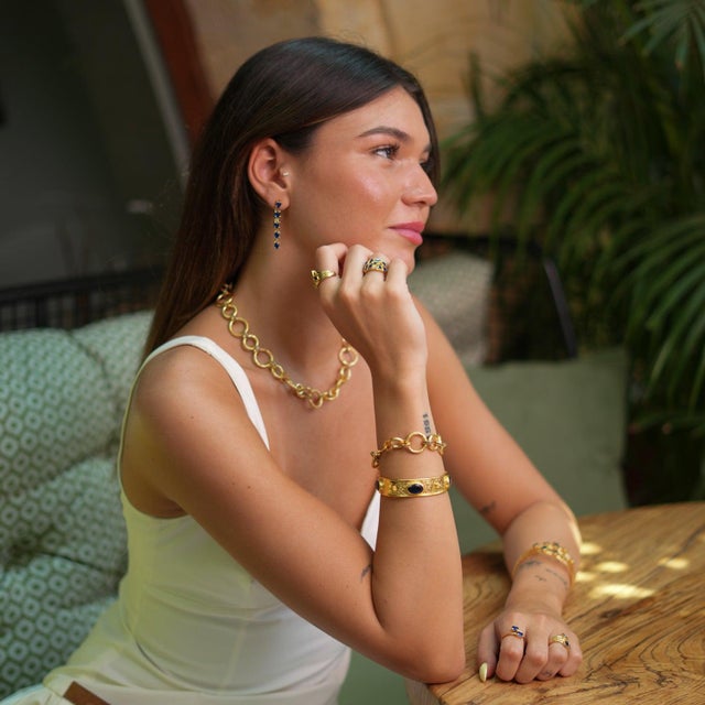 Make a statement with the Cleopatra Sapphire Gemstone & Gold Antique Cuff Bracelet , a stunning piece adorned with...