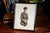 This World War I-era original photograph features a young soldier in uniform, posed in a formal, dignified stance. He is...