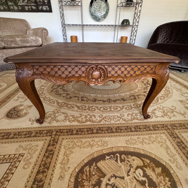 This Louis XV Style Oak Parquet Center Table features a finely contoured and beveled top frame surrounding diamond parquet...