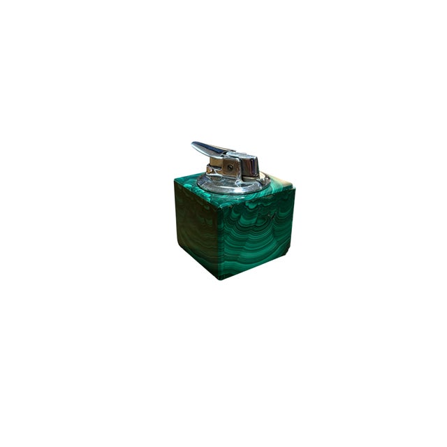 Italian malachite smoking set from Northern Italy, comprising a lighter, cigarette case, and ashtray. The richness of the...