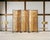 A rich and dramatic Chinese Export folding six-panel double-sided coromandel screen executed in radiant gilt and lacquer....
