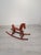 This classic wooden rocking horse is a timeless children's toy crafted in a retro/vintage style. It features a minimalist,...