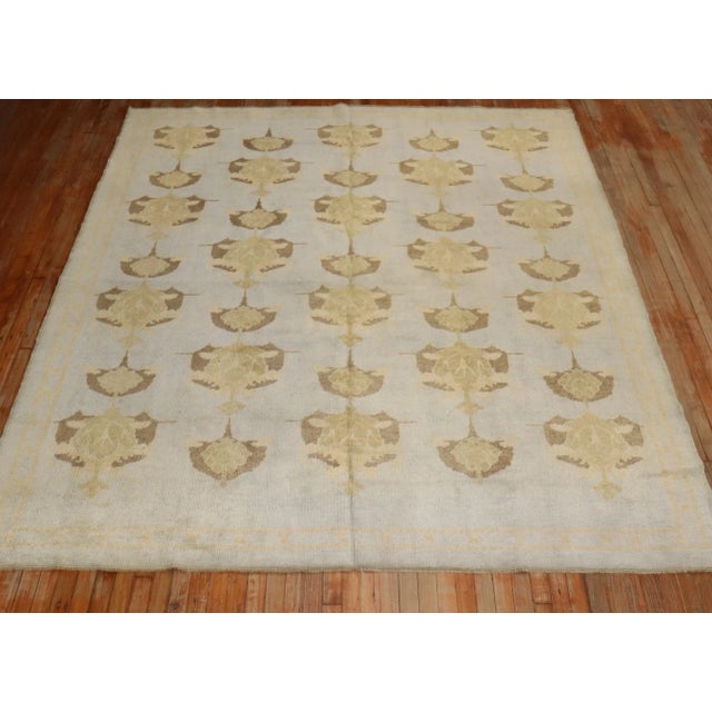 21st century pre-owned Turkish Repro rug with a Irish Donegal-inspired arts and crafts pattern on a soft blue field....