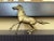 Etched in detail with a chiseled face, mane and consisting of solid brass this 'heavy breathing' galloping horse is sure...
