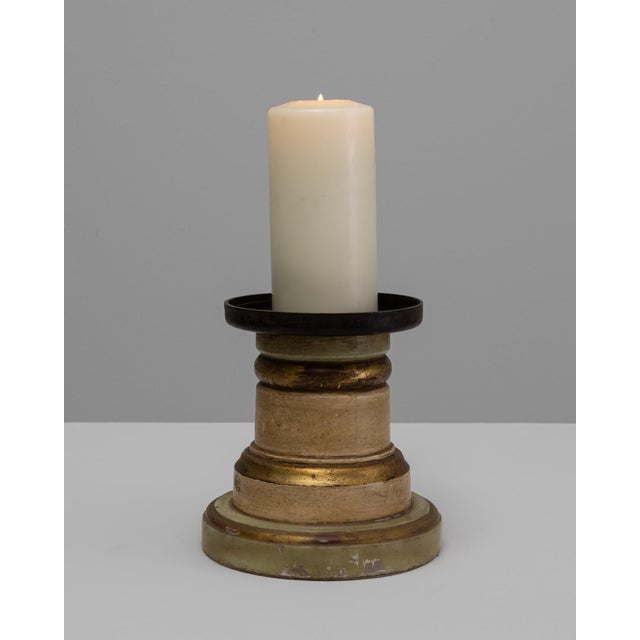 This 19th-century French wooden candlestick holder features a richly patinated, gilded finish and a classic turned...