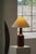 A danish ceramic table lamp produced by desire stentøj during the 1960s, featuring a richly textured cylindrical base with...
