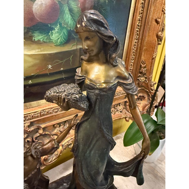 An elegant bronze sculpture depicting a tender moment between and Mother and Child, inspired by the romantic style of...