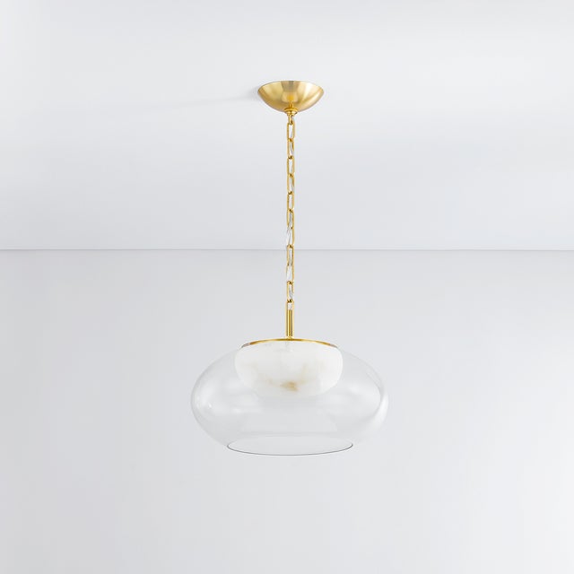 Moore stuns in its simplicity. Available in two sizes, this nested flush mount design features an outer clear glass shade...