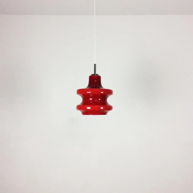 Article: Hanging light Producer: Peill & Putzler Origin: Germany Age: 1970s This fantastic red hanging lights was designed...