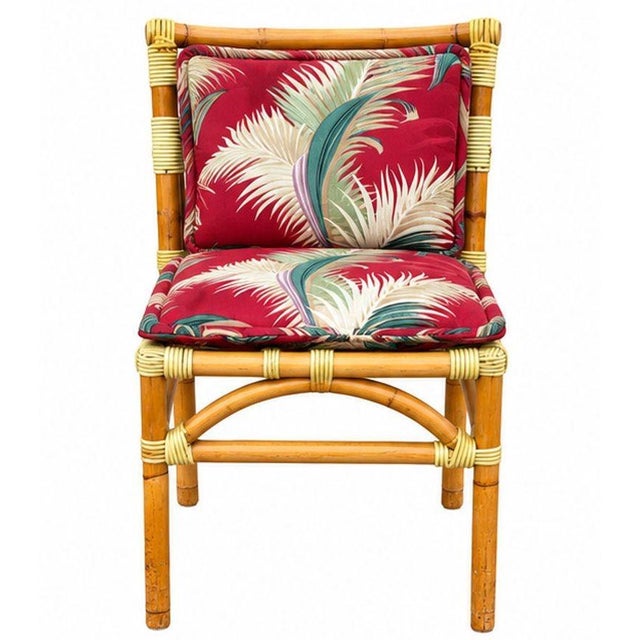 A restored mid-century rattan dining chair features an elegant stick rattan seat and 3-strand back design. The chairs...