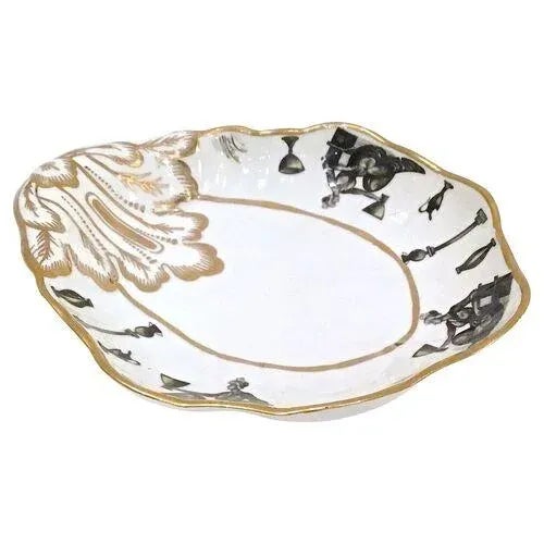 Antique porcelain acanthus leaf dish with seated classically robed figures holding urns and ewers encircling the border....