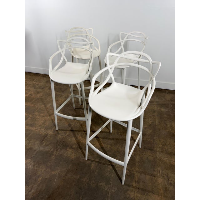 A striking set of four “Masters” bar stools designed by Philippe Starck in collaboration with Eugeni Quitllet for Kartell,...