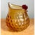 This vintage novelty pitcher is blown from amber glass and whimsically shaped as a plump, roosting hen, with the vessel's...