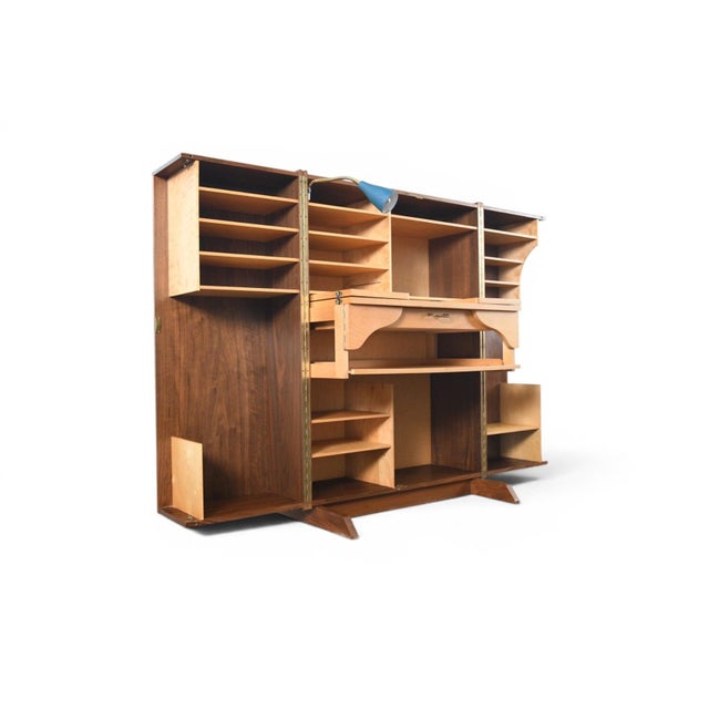 A brilliant space-saving solution from 1960s Germany. Closed, this piece presents as a clean walnut cabinet just 32" wide....