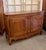 Early 19th century Country French Buffet, entirely hand-crafted from French cherry, and accented with iron hinges, hand...