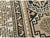 This early 20th century Caucasian Shirvan rug, measuring 2' 8" x 4' 10", presents a striking interplay of bold geometry...