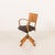 This Italian mid-century desk chair from the 1950s is a rare and highly distinctive example of functional modernist...