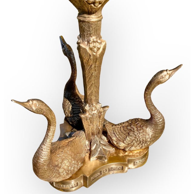 A stunning antique French Napoleon III gilt bronze centerpiece on a centralized column with acanthus leaves, drake feet...