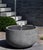 A free-standing basin fountain in an Alpine Stone finish.