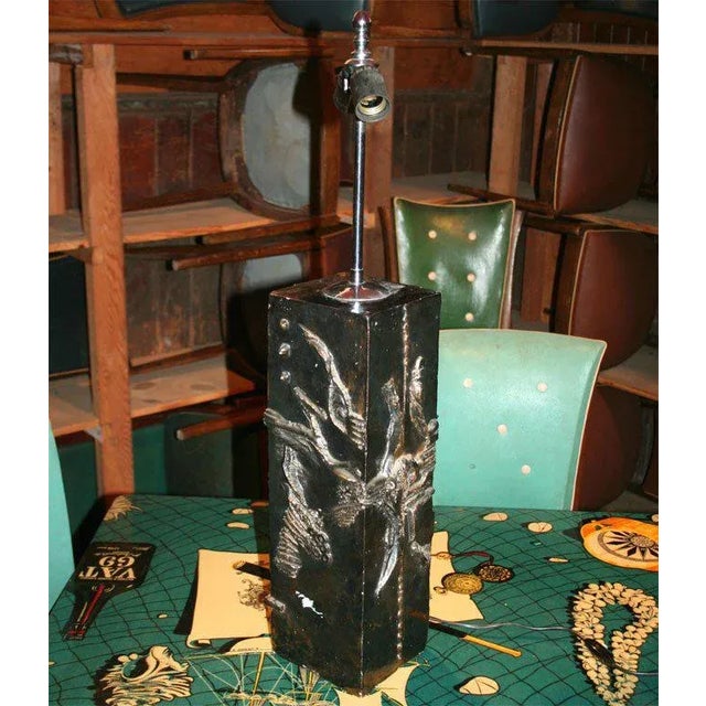 Metallic looking glazed rectangular pottery lamp depicting sea life and bubbles.