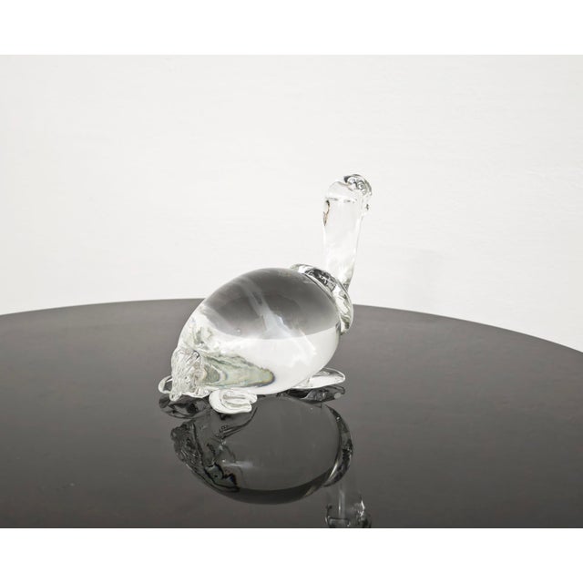 Clear Murano glass turtle sculpture produced by the renowned Italian glassworks V. Nason & C. Featuring a smooth design,...