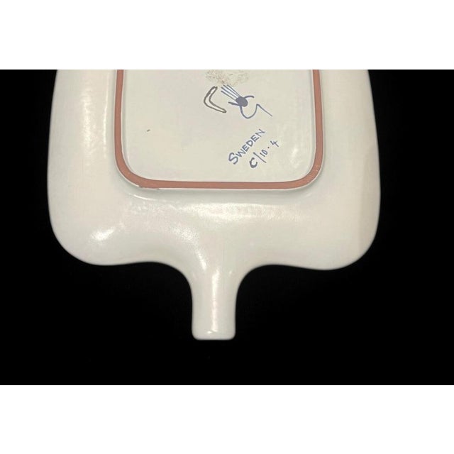 A large dish in faience designed by Stig Lindberg at Gustavsberg Studio, it´s 30 x 19,5 x 3cm. It´s in excellent vintage...