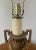 A handsome late 20th century Neoclassical table lamp in an urn-form silhouette, detailed with a Greek key border, squared...