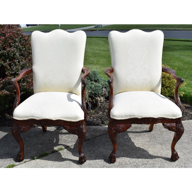 Vintage (1980's) Pair of Arm Chairs have a Federal Style. The Wood is Mahogany - Carved - Heavily Carved with a Claw Foot....