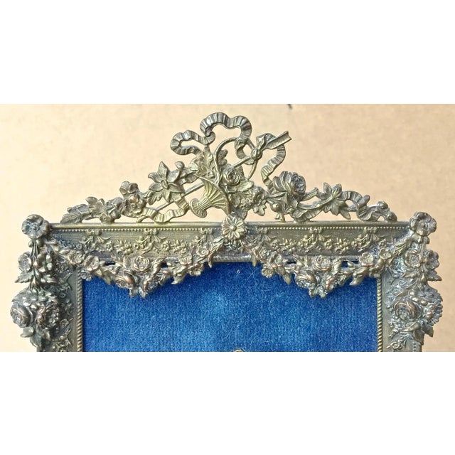 Antique floral brass framed porcelain pendant portraits. Three ladie’s oval pendant portraits handpainted on porcelain and...