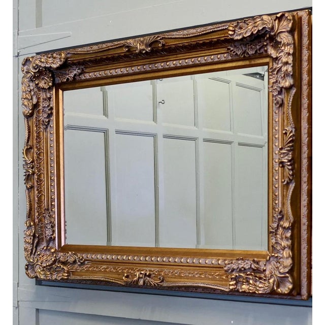 Large Decorative Gilt Wall Mirror This is a lovely old bevelled mirror, it is set in a large Decorative Gilt 5” wide...
